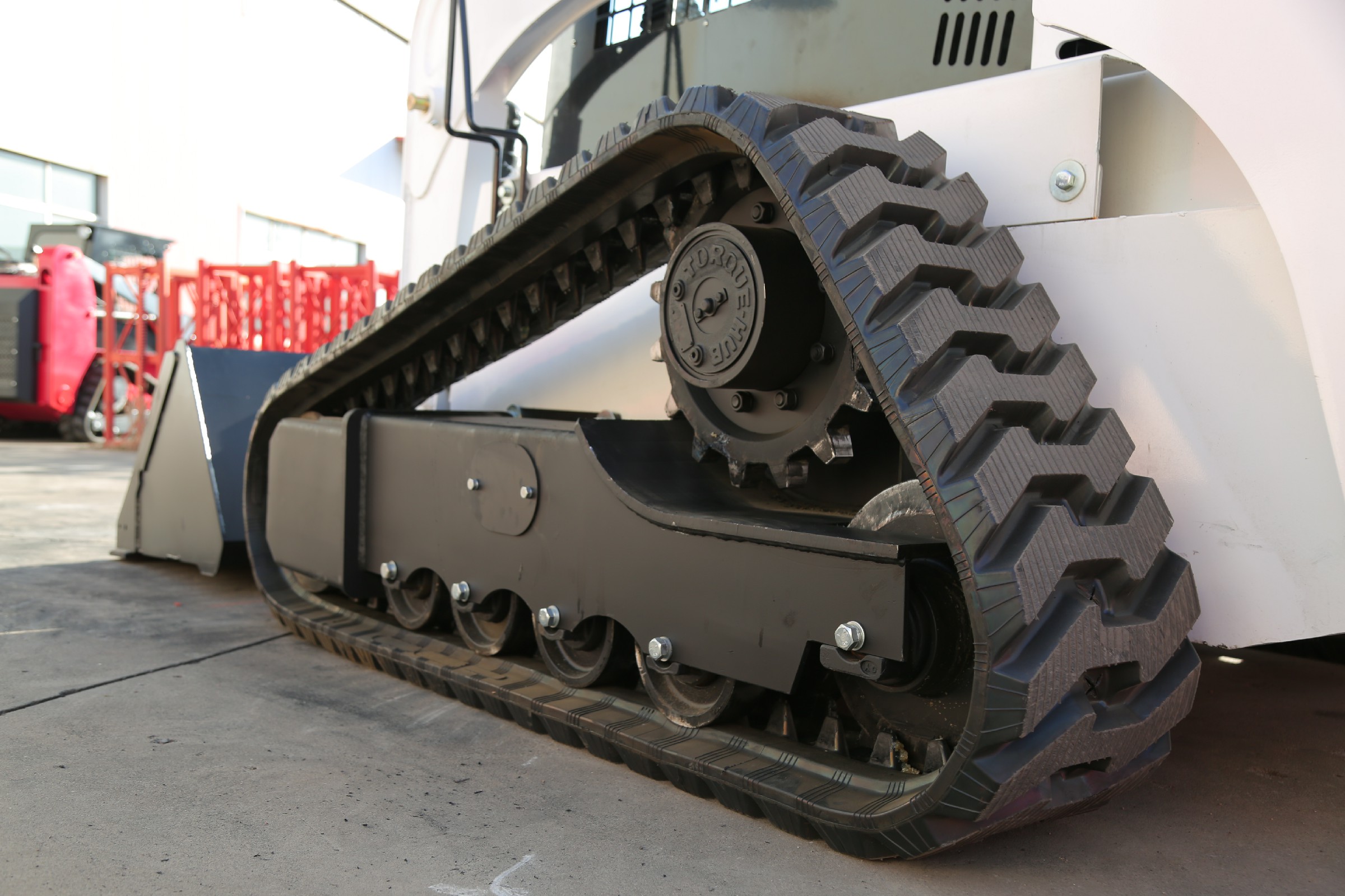 Close-up of the HJC100 rubber track and undercarriage