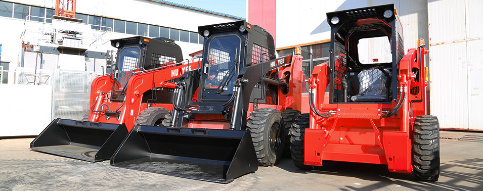A lineup of Huayee HJC100 skid steers at the Huayee facility