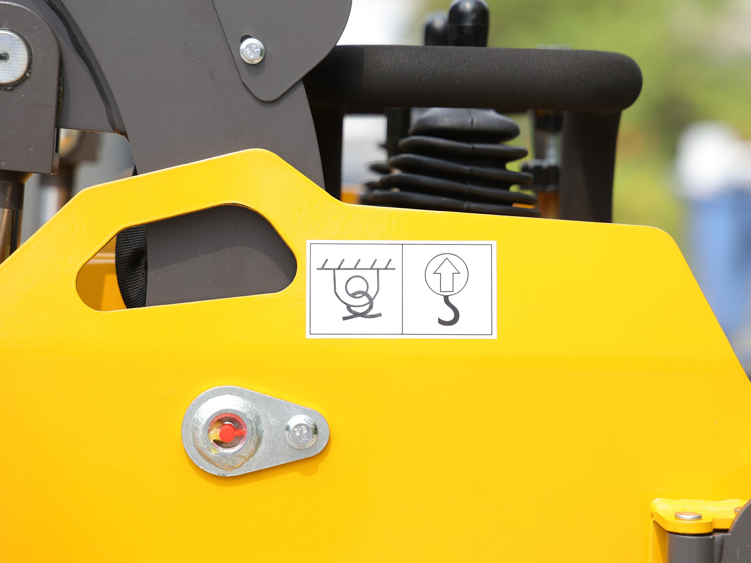 Close-up of the HY360W quick-attach coupler and lift-point decal
