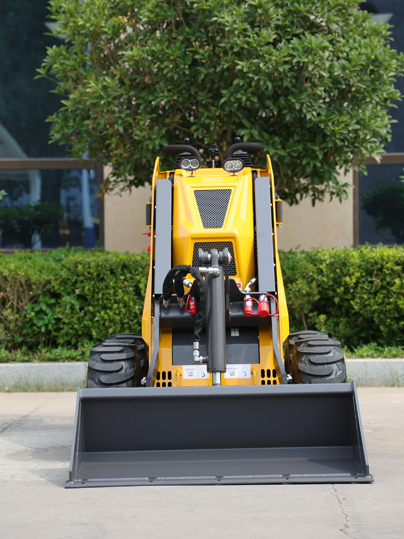 Huayee HY360W mini skid steer, front view with bucket lowered